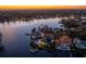 Night view of waterfront homes and a calm bay at 930 Monterey Ne Pt, St Petersburg, FL 33704