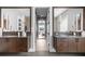 Double vanity bathroom with dark brown cabinets and a view into the bedroom at 930 Monterey Ne Pt, St Petersburg, FL 33704