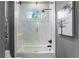 Spa-like bathroom with a walk-in shower and a soaking tub at 930 Monterey Ne Pt, St Petersburg, FL 33704