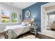 Cozy bedroom with a queen-size bed and a view at 930 Monterey Ne Pt, St Petersburg, FL 33704