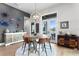 Casual dining area with rustic wooden table and leather chairs at 930 Monterey Ne Pt, St Petersburg, FL 33704