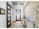 Bright entryway with wood floors and stone wall at 930 Monterey Ne Pt, St Petersburg, FL 33704