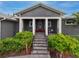 Gray house with a white door and large front porch at 930 Monterey Ne Pt, St Petersburg, FL 33704