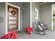 Modern front porch with rocking chairs and planters at 930 Monterey Ne Pt, St Petersburg, FL 33704