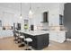 Contemporary kitchen with white cabinets, stainless steel appliances, and quartz countertops at 930 Monterey Ne Pt, St Petersburg, FL 33704