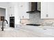 Modern kitchen with stainless steel appliances and white shaker cabinets at 930 Monterey Ne Pt, St Petersburg, FL 33704