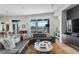 Living room boasts water views, sectional sofa, and a large flat screen TV at 930 Monterey Ne Pt, St Petersburg, FL 33704