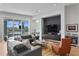 Spacious living area with water views, comfortable seating, and built-in entertainment center at 930 Monterey Ne Pt, St Petersburg, FL 33704