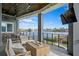 Relaxing covered patio overlooking the water with a fire pit and seating at 930 Monterey Ne Pt, St Petersburg, FL 33704