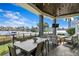 Outdoor patio with water views, seating area, and dining table at 930 Monterey Ne Pt, St Petersburg, FL 33704