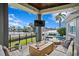 Expansive patio with fire pit, seating, and stunning water views at 930 Monterey Ne Pt, St Petersburg, FL 33704