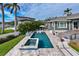 Large pool and spa with outdoor kitchen and seating at 930 Monterey Ne Pt, St Petersburg, FL 33704