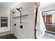 Large walk-in shower with double shower heads and marble-look tile at 930 Monterey Ne Pt, St Petersburg, FL 33704
