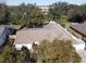 Aerial view of house showing roofline and surrounding trees at 10215 Evening Trail Dr, Riverview, FL 33569