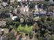 Aerial view of neighborhood with pond and houses at 10215 Evening Trail Dr, Riverview, FL 33569