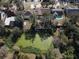 Aerial view of neighborhood with pond and houses at 10215 Evening Trail Dr, Riverview, FL 33569