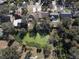 Aerial view of neighborhood with pond and houses at 10215 Evening Trail Dr, Riverview, FL 33569