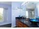 Bathroom with a double vanity and a walk-in shower at 10215 Evening Trail Dr, Riverview, FL 33569