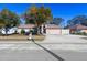 House exterior showcasing a spacious driveway and yard at 10215 Evening Trail Dr, Riverview, FL 33569