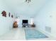 Spacious living room featuring a large TV and tile floors at 10215 Evening Trail Dr, Riverview, FL 33569