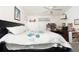 Main bedroom with king bed, desk, and ceiling fan at 10215 Evening Trail Dr, Riverview, FL 33569