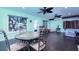 Sunroom with table and chairs, ceiling fans, and access to backyard at 10215 Evening Trail Dr, Riverview, FL 33569