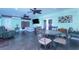Sunroom with seating area and dining table, offering ample natural light at 10215 Evening Trail Dr, Riverview, FL 33569