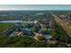 Aerial view of community, featuring a lake, pool, and numerous buildings at 11901 4Th N St # 9105, St Petersburg, FL 33716
