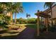 Backyard with pergola, seating area, and a swing at 11901 4Th N St # 9105, St Petersburg, FL 33716