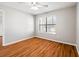 Bright bedroom with wood-look floors and ceiling fan at 11901 4Th N St # 9105, St Petersburg, FL 33716