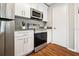 Modern kitchen with white cabinets and stainless steel appliances at 11901 4Th N St # 9105, St Petersburg, FL 33716