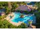 Community pool and spa with surrounding lounge chairs at 11901 4Th N St # 9105, St Petersburg, FL 33716