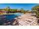 Community pool area with lounge chairs and cabana at 11901 4Th N St # 9105, St Petersburg, FL 33716