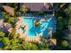 L-shaped community pool with plenty of lounge chairs at 11901 4Th N St # 9105, St Petersburg, FL 33716