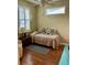 Small bedroom with window seat and wood floors at 1213 Huntington Greens Dr, Sun City Center, FL 33573