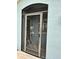Front door with a decorative screen and glass accents at 1213 Huntington Greens Dr, Sun City Center, FL 33573