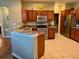 Kitchen boasts granite countertops and stainless steel appliances at 1213 Huntington Greens Dr, Sun City Center, FL 33573