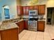 Spacious kitchen with granite countertops, stainless steel appliances, and ample cabinetry at 1213 Huntington Greens Dr, Sun City Center, FL 33573