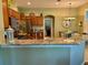Kitchen features granite countertops, stainless steel appliances, and a breakfast bar at 1213 Huntington Greens Dr, Sun City Center, FL 33573