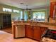 Kitchen with granite countertops, stainless steel appliances, and wood cabinets at 1213 Huntington Greens Dr, Sun City Center, FL 33573