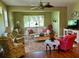 Comfortable living room featuring hardwood floors and ample seating at 1213 Huntington Greens Dr, Sun City Center, FL 33573
