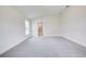 Bright bedroom with carpet and en-suite bathroom at 13278 Ogden Glade Rd, Dade City, FL 33525