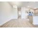 Bright dining room with hardwood floors and modern chandelier at 13278 Ogden Glade Rd, Dade City, FL 33525