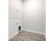 Convenient laundry room with built-in shelving at 13278 Ogden Glade Rd, Dade City, FL 33525