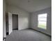 Bedroom with carpet, a closet, and a window at 13290 Ogden Glade Rd, Dade City, FL 33525