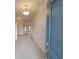 Bright entryway with tile floors leading to the living area at 13290 Ogden Glade Rd, Dade City, FL 33525