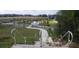 Concrete stairway leading down into a residential community at 13290 Ogden Glade Rd, Dade City, FL 33525