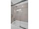 Clean bathroom with a shower/tub and glass sliding doors at 1613 Heather Pl, Palm Harbor, FL 34684
