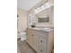 Bathroom with vanity, large mirror, and a shower/tub combo at 1613 Heather Pl, Palm Harbor, FL 34684