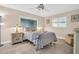 Bedroom with a queen-size bed, two nightstands and ceiling fan at 1613 Heather Pl, Palm Harbor, FL 34684
